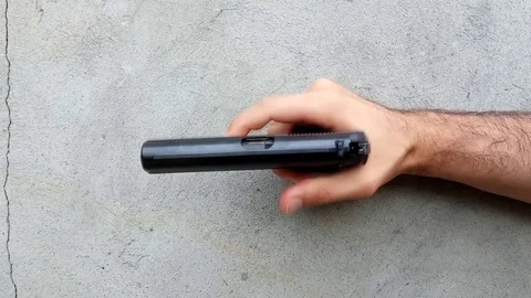 Gun on a dark background Stock Footage 110800467