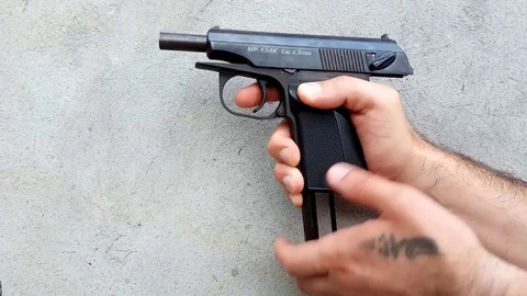 Gun on a dark background Stock Footage 110800662