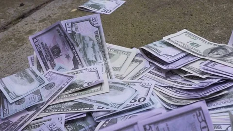 Gun falls on the money Video stock 80229661