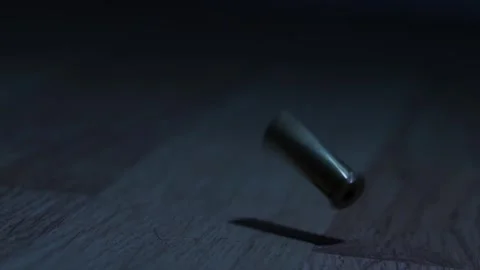 Gun Fired As Bullet Case Falls, At Night Indoors Stock Footage 305992613