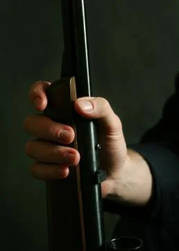 Gun in a hand Stock Photos