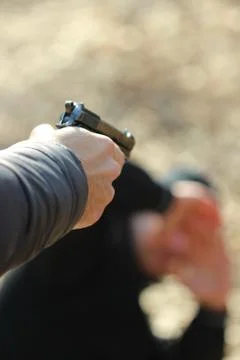 Gun in the hand Stock Photos