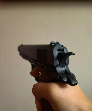 Gun in hand Stock Photos