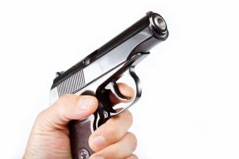 Gun in hand on a white background. Stock Photos