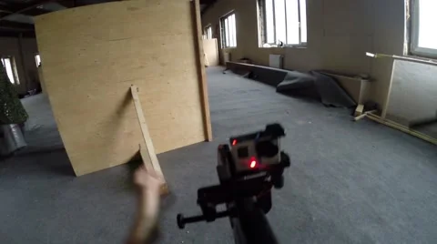 Gun in hands with camera at lasertag game in abandoned building Stock Footage 64817207
