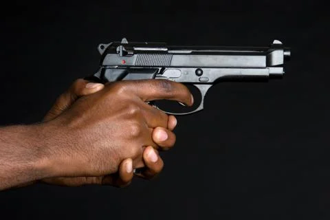 Gun in hands Stock Photos