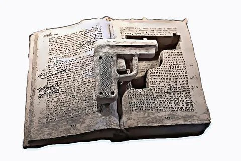 The gun is hidden in a book. Stock Photos