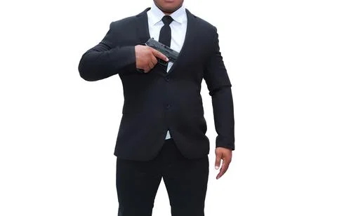 Gun man in black suit pulling pistol from gun cabinet on isolated white backg Stock Photos