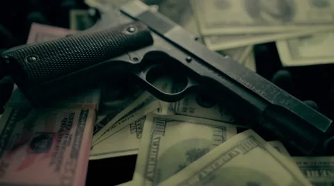 Gun on money Vídeos de archivo 63541284