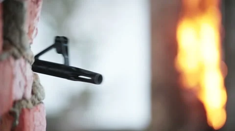 Gun out from behind the wall and make 2 shots Stock Footage 44787013