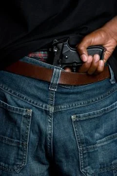 Gun in pants Stock Photos