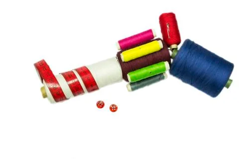 Gun from sewing spools with red buttons Stock Photos