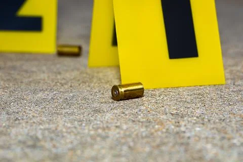 Gun shell casing at crime scene. Stock Photos