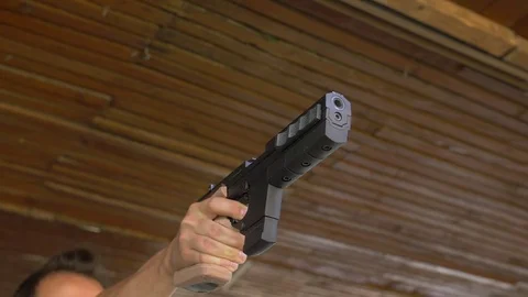 Gun shooting in super slow motion 스톡 동영상 84604124