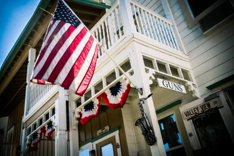 GUN STORE WITH FLAG Stock Photos
