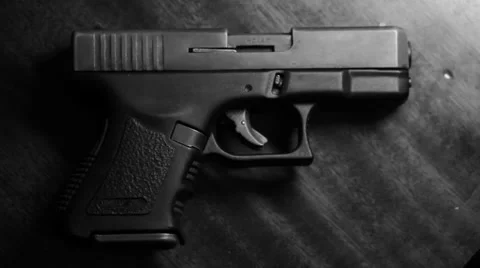 A gun on a table 스톡 동영상 40796487