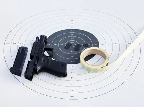 Gun on a target Stock Photos