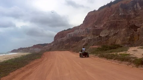 Gunga cliffs bordering the sea in Alagoas, Brazil Видео 128998023