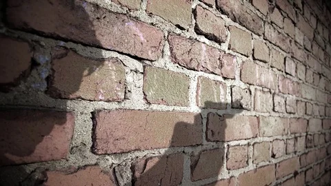 Gunman Shooting A Gun, Shadow On Brick Wall Stock Footage