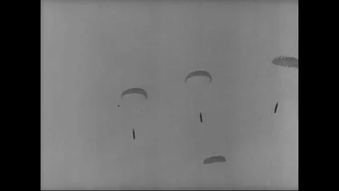 Guns and ammunition sail down in parachutes and assembled on ground - 1942 스톡 동영상 83831218