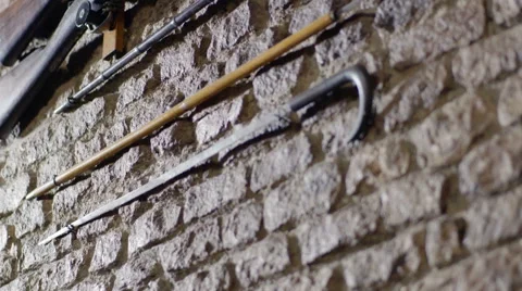 Guns lined up horizontal on Marble wall Stock Footage 67006562
