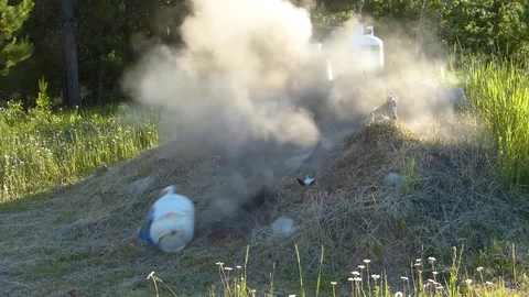 Guns Shooting Empty Propane Cylinders Stock Footage 83797671