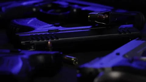 Guns On A Table Pan Stock Footage 170158465