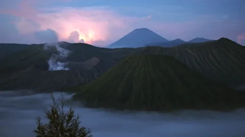 Gunung Bromo, Mount Batok and Gunung Semeru at Sunrise in Java, Indonesia Stock Footage