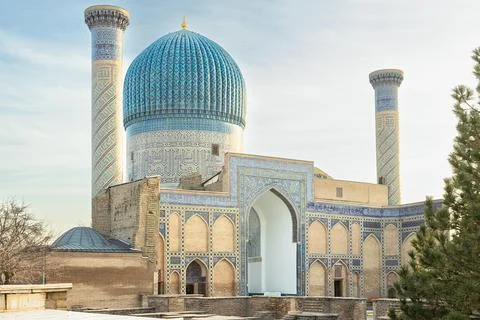 Gur-e-Amir mausoleum with its iconic turquoise ribbed dome and twin minaret.. Stock Photos