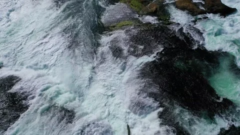 Gushing waters flowing through rocks - Drone view Stock Footage 313048977