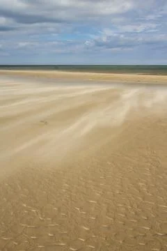 A gust of wind blowing over the beach Stock Photos