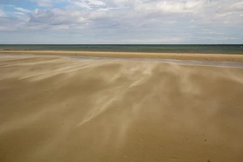 A gust of wind blowing over the beach Stock Photos