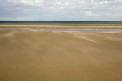A gust of wind blowing over the beach Stock Photos