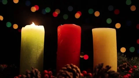 A gust of wind blows the fire of three candles Stock Footage 83416372