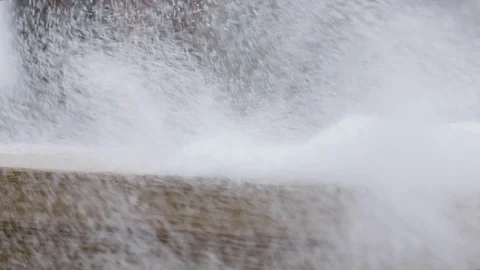 Gust of wind blows snowflakes across a balcony railing in rural wooded area Stock Footage 102864888