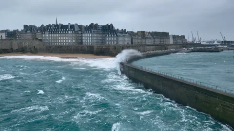 Gusty winds churn waves at Saint Malo's seafront. Stock Footage 260828070