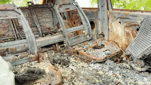 Gutted burned car interior exposes severe devastation outdoors Stockbeeldmateriaal 336864416