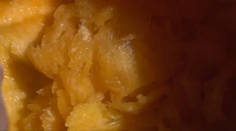 Gutting flesh from pumpkin and shake it out Stock Footage