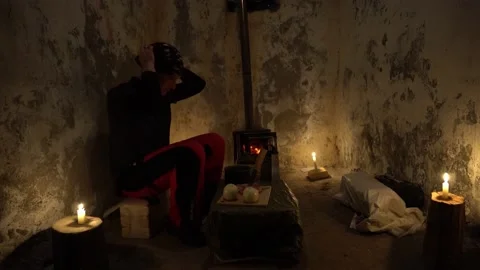 The guy in the abandoned hut is going to cook Video stock 233056063