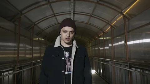 Guy is in the above-ground passage Video stock 80466014