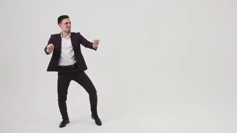 Guy is Actively Dancing on the Cyclorama Stock Footage 144636711