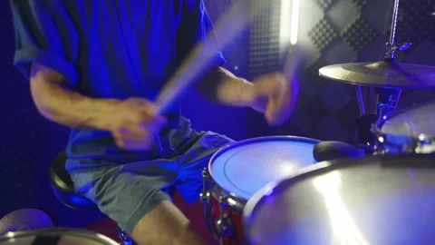 The guy is actively training to play the drums. The camera moves from the drums  Stock Footage 200228748