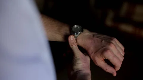 The guy adjusts the mechanical watch on his wrist. Close up. Stylish guy. 스톡 동영상 133013357
