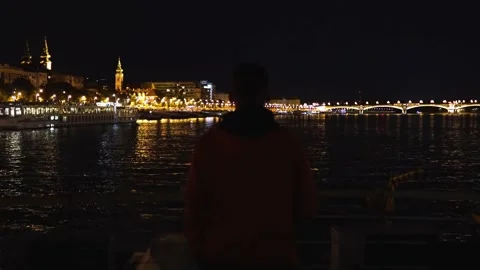 The guy admires the night Budapest in the lights Video stock 218118978