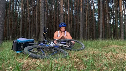 The guy after the accident is sitting next to the bike Stock Footage 111229868