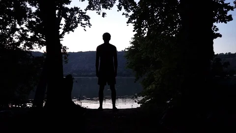 Guy after sunset by the river, motivation Stock Footage 114631325