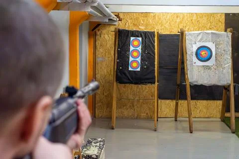 Guy aiming carefully at target in shooting range Stock Photos