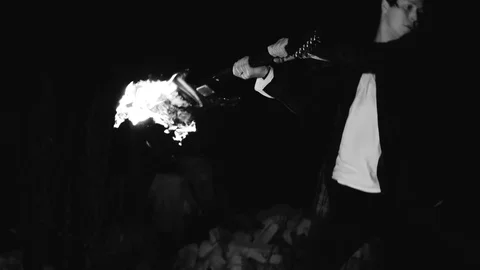 The guy with all his strength hits a burning guitar on the ground Vídeo Stock 114519514