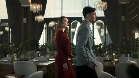 Guy and a girl dressed nicely came to a romantic date in a restaurant Stock Footage 315230709