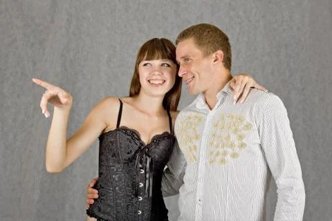 A guy and a girl facing the same direction Stock Photos